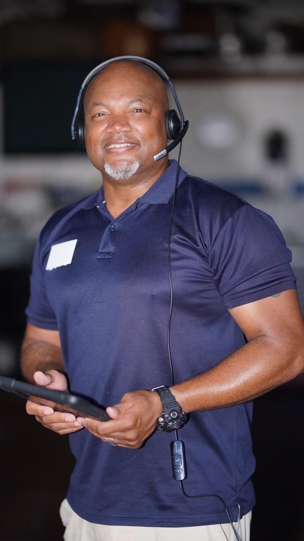 aLex Adviser wearing headset, ready to videochat and help review used cars